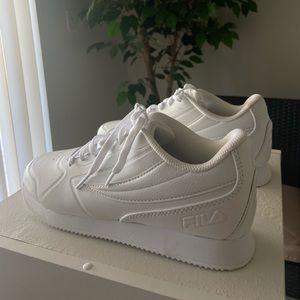 Women’s white Fila sneakers